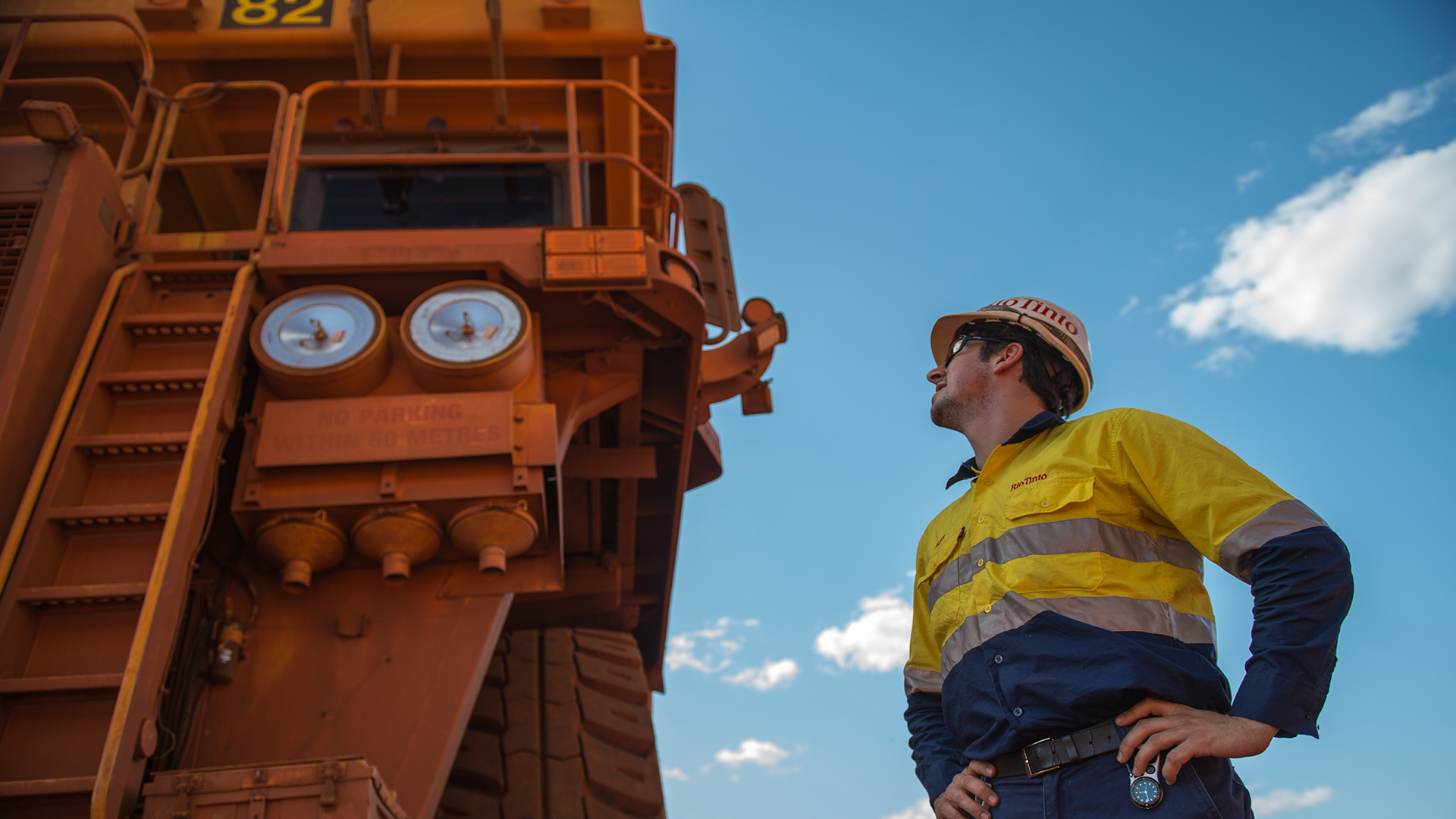 Employee looking up at machinery