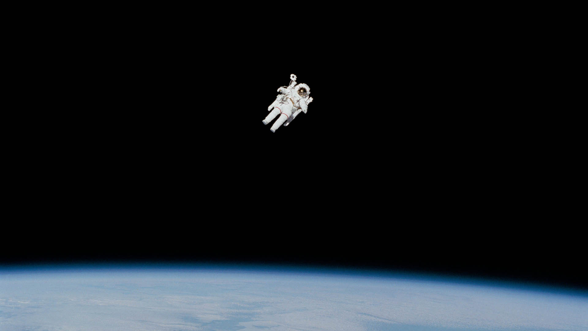 Astronaut floating above Earth