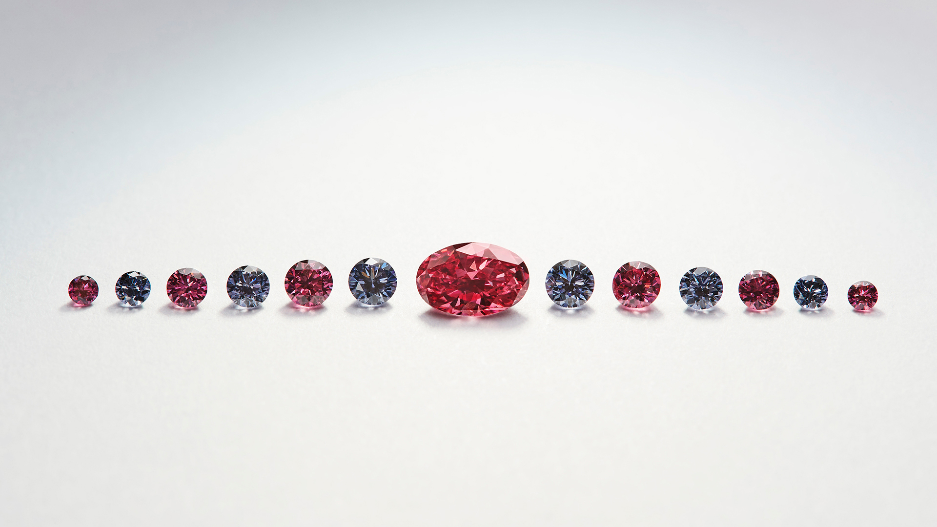 Petit Oiseau -  a collection of blue and red diamonds from the APD Petite Suites Collection