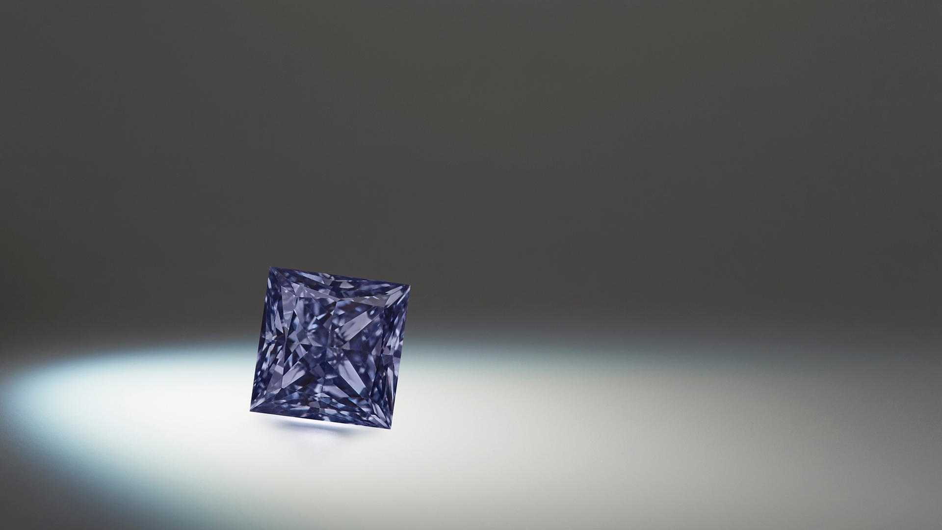 Argyle Emrys™, a 0.43ct princess shaped Fancy Deep Grayish Violetish Blue diamond from the 2020 APD Tender.